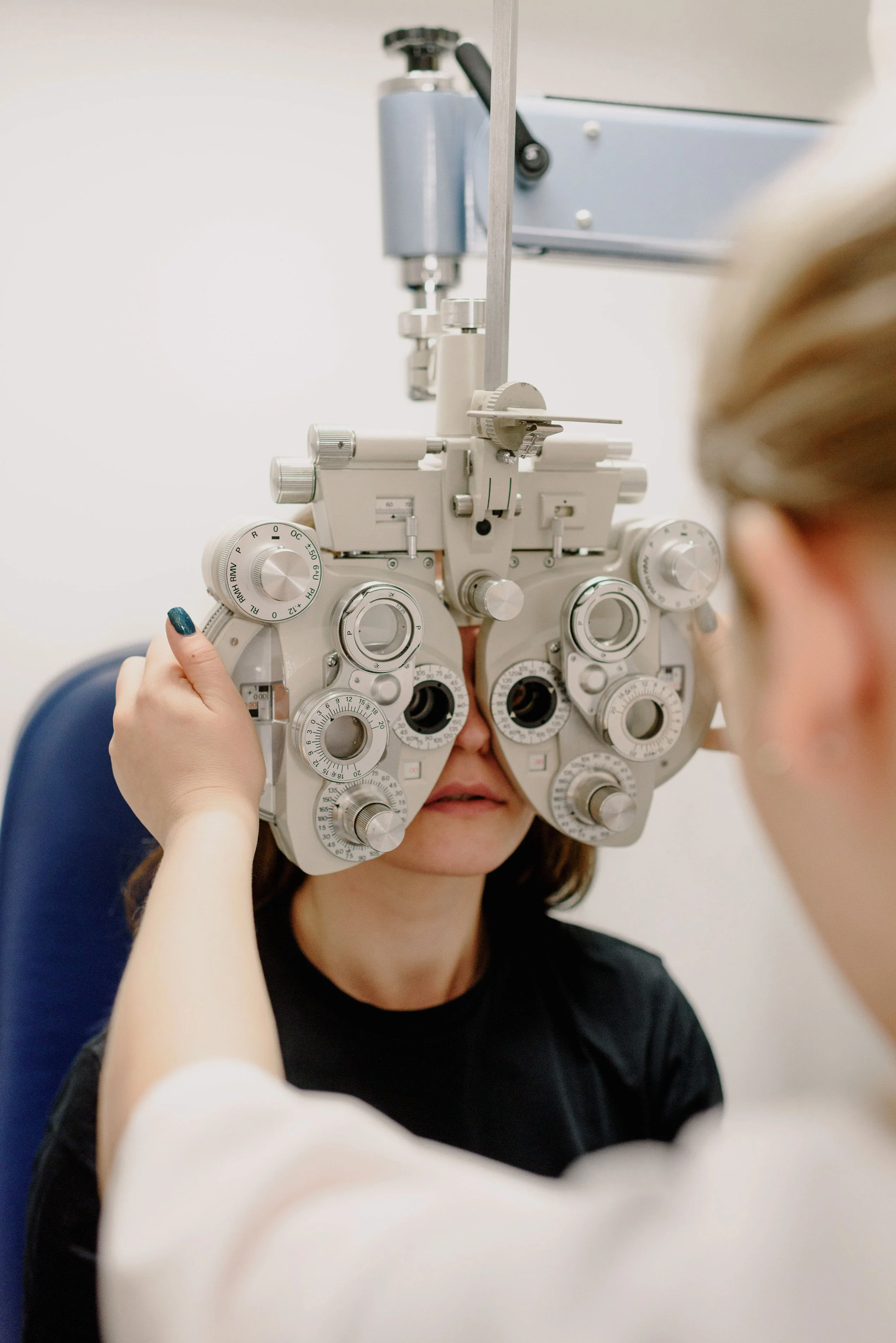 Vision care professional providing an eye examination